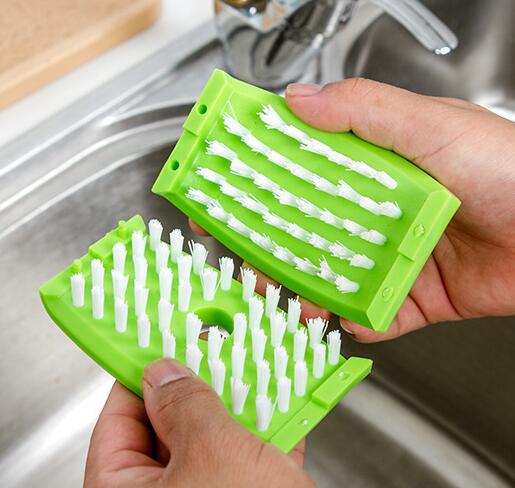 A creative kitchen cleaning brush with suction cup, perfect for washing knives, forks, chopsticks, fruits, and vegetables easily.