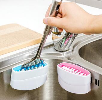 A creative kitchen cleaning brush with suction cup, perfect for washing knives, forks, chopsticks, fruits, and vegetables easily.