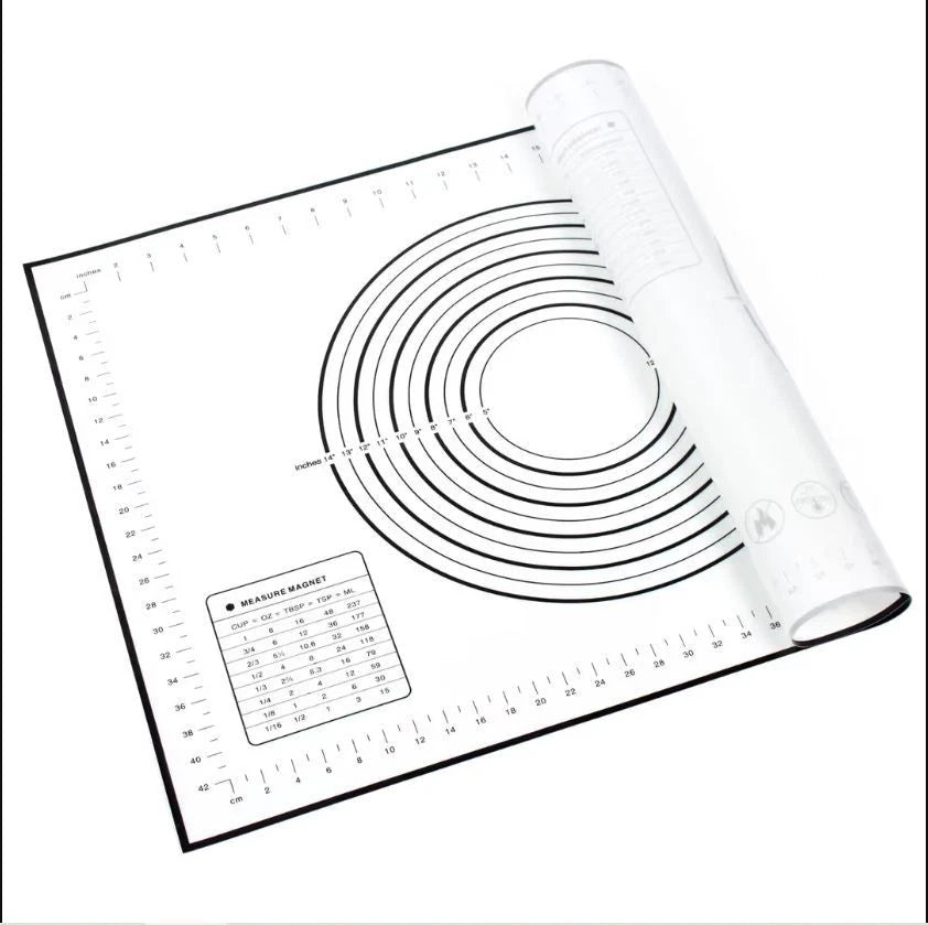 Roll of paper with measurement chart and ruler on a white background